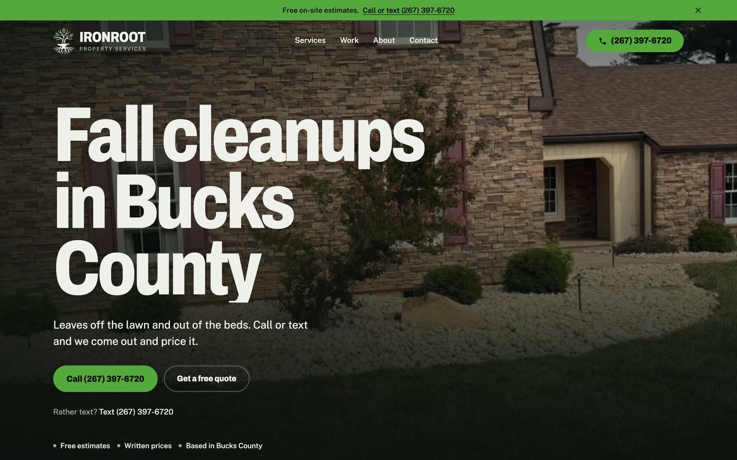 The IronRoot homepage on a laptop: a stone house with fresh white rock beds, the headline “Fall cleanups in Bucks County,” and a green button to call (267) 397-6720.